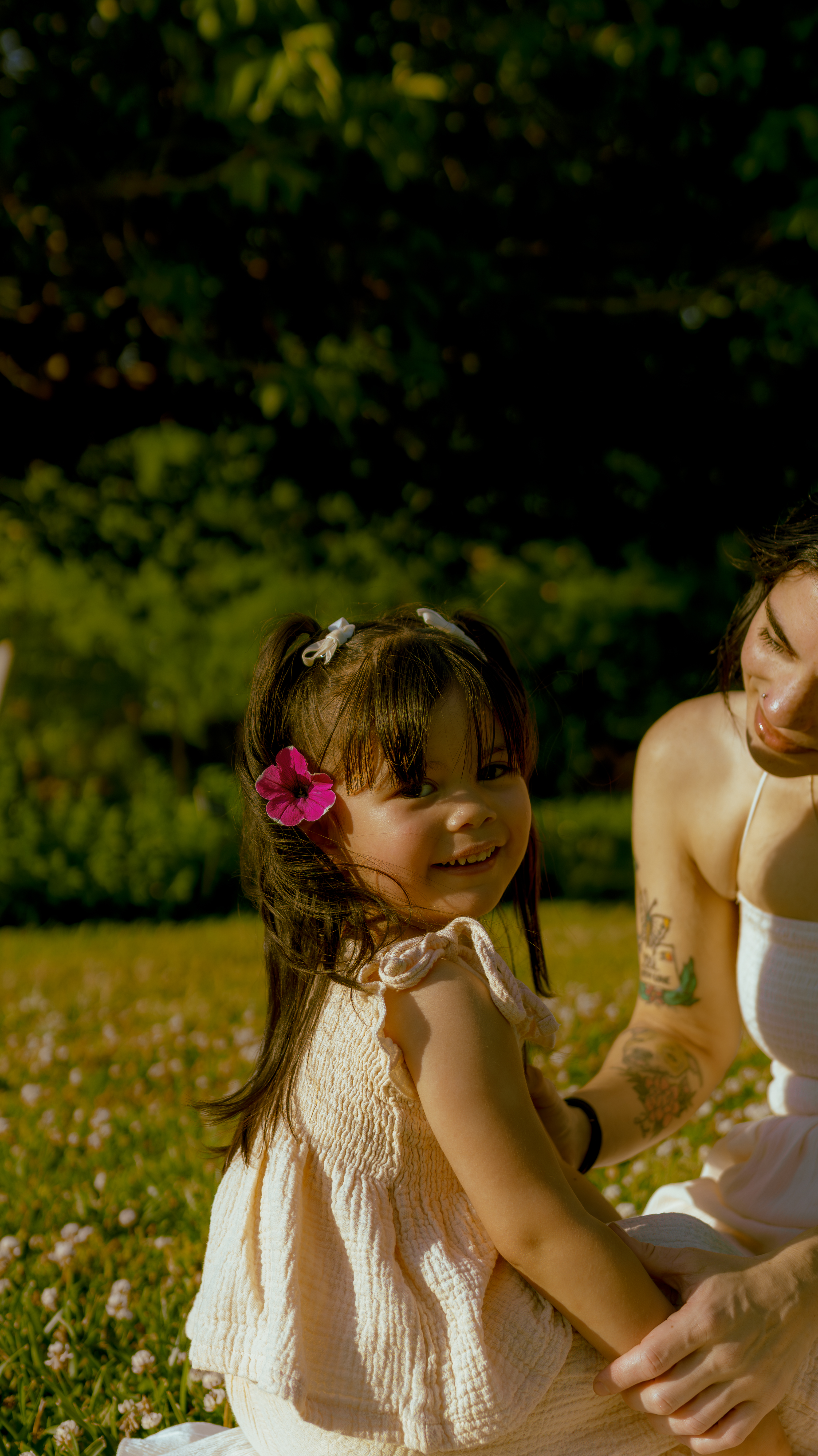 little girl with purple flower in her hair
